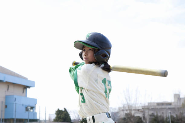 istock Batting baseball girls 844726300