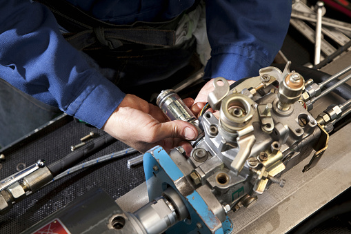 Close up of lathe machine processing in workshop.