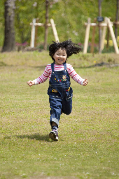 istock Girl running on the grass 844735268