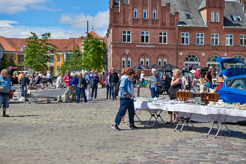 Summer and flea market on the city square in Svendborg. Svendborg is an old port city and market town with traditional Danish buildings. In the summertime the square is nused for local flea market