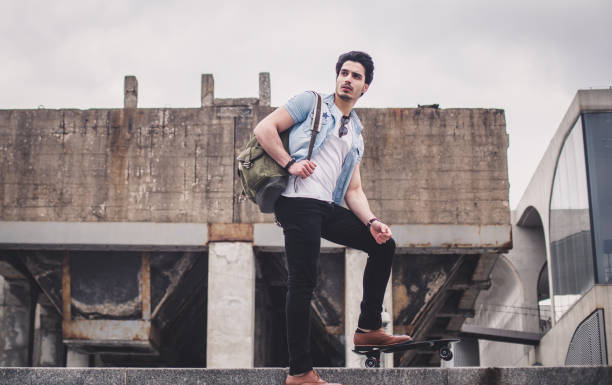istock Man with penny board standing outdoors 844748874