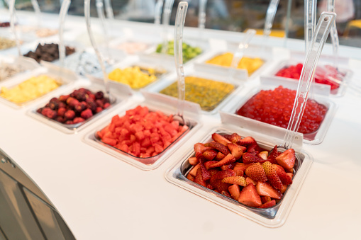 Close-up on some sundae toppings at an ice cream shop - small business concepts
