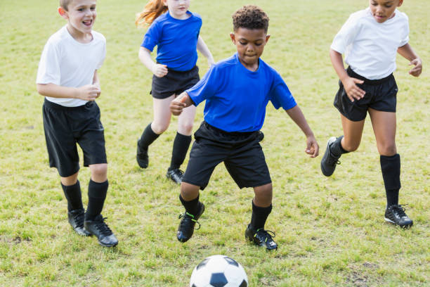 istock Children playing soccer 844796642