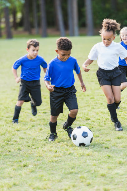 istock Children playing soccer 844796702