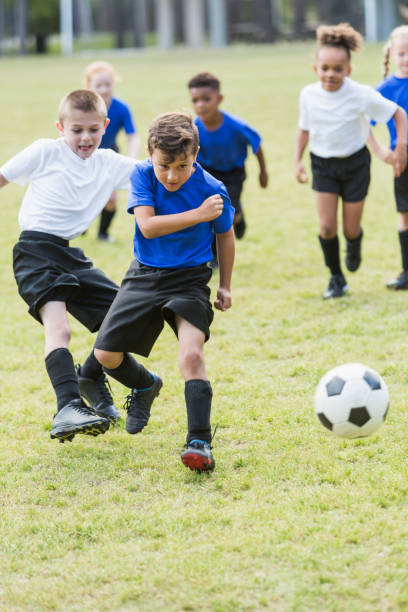 istock Children playing soccer, boys compete for ball 844796896