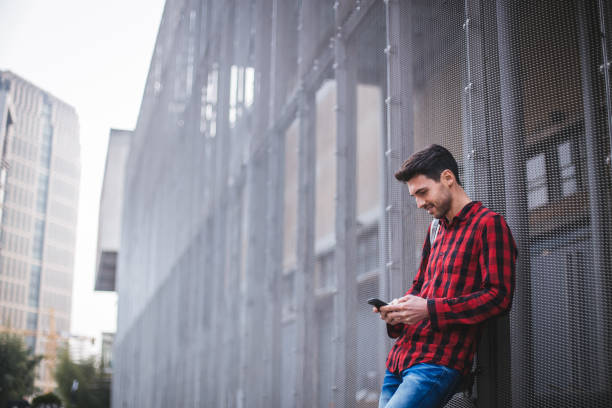 istock Hipster man typing message on smartphone 844797560