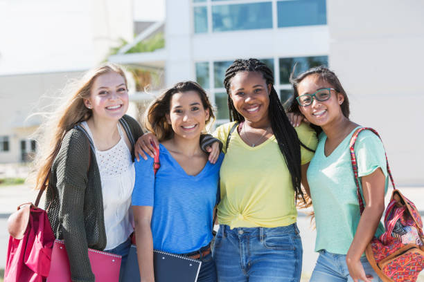 istock Four multi-ethnic teenage students on campus 844817612