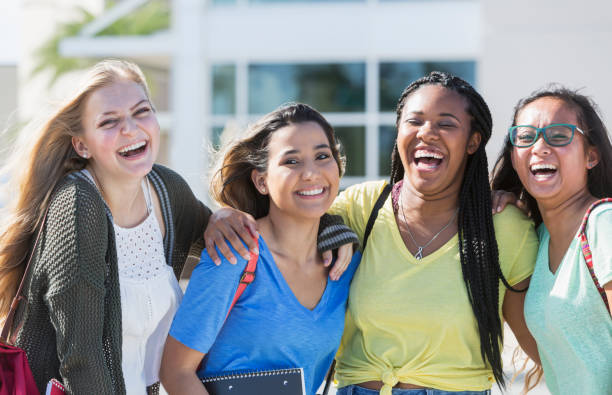 istock Four multi-ethnic teenage students on campus 844817788