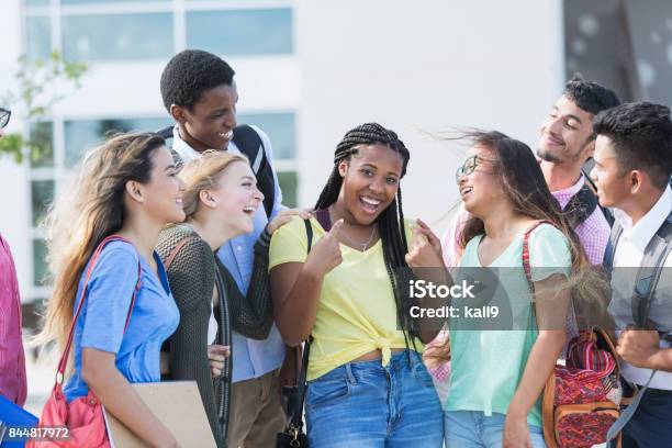 Teenage Girl With Multiethnic Friends Outside School Stock Photo - Download Image Now