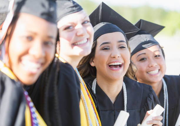istock Four young women graduating from high school or college 844818072