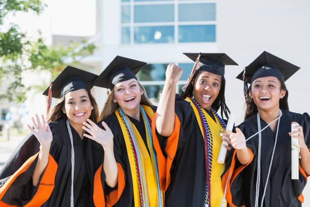 istock Four young women graduating from high school or college 844818076
