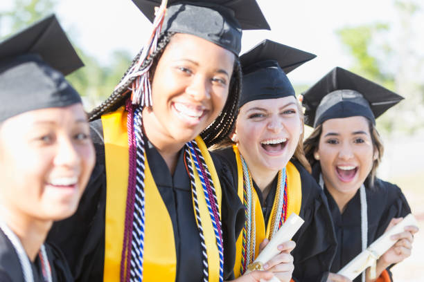 istock Four young women graduating from high school or college 844818142