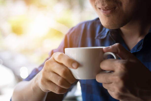 istock Asian man drinking hot coffee in morning. 844822176
