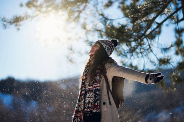 in the spirit of the season - coat warm clothing one person joy imagens e fotografias de stock