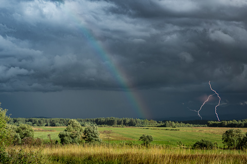 Rainbow and lightning in Tatra Mountains in southern Poland.