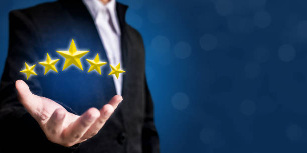 istock Review, increase rating or ranking, evaluation and classification concept. Businessman hand holding yellow five stars 844862130