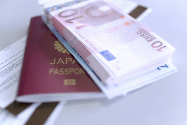 istock Euro bank notes and passports 844874120