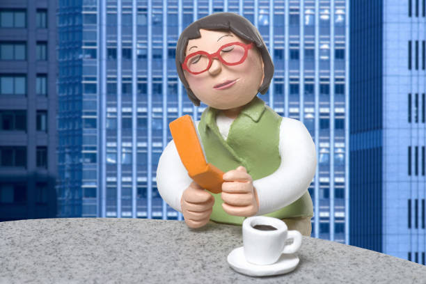 Doll female employees to a mobile phone