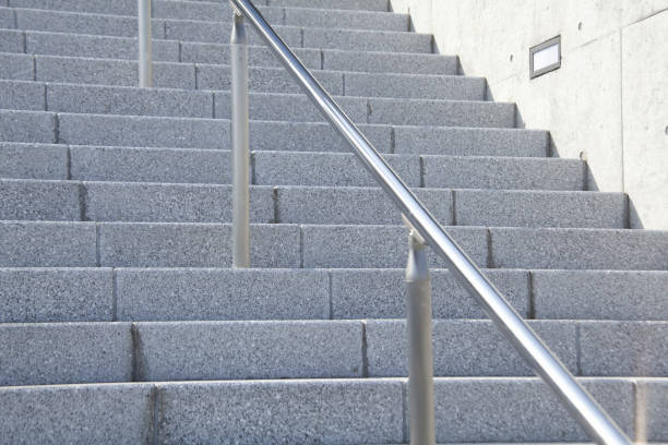 istock Stainless steel pipe with a stone staircase handrail 844910426