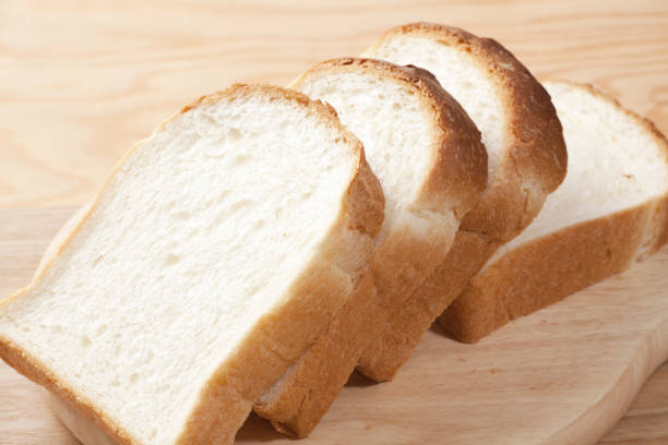 istock Loaf of bread cut with knife. 844913600