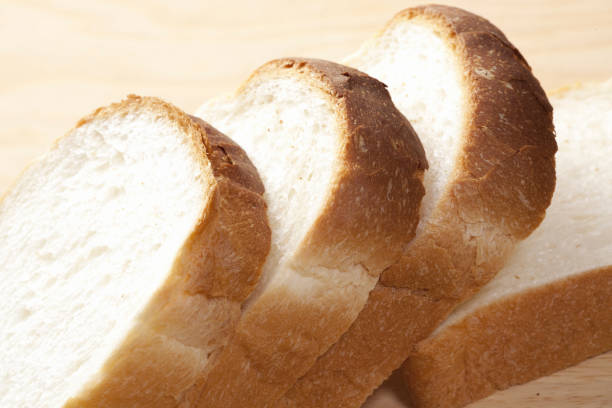 istock Loaf of bread cut with knife. 844913616