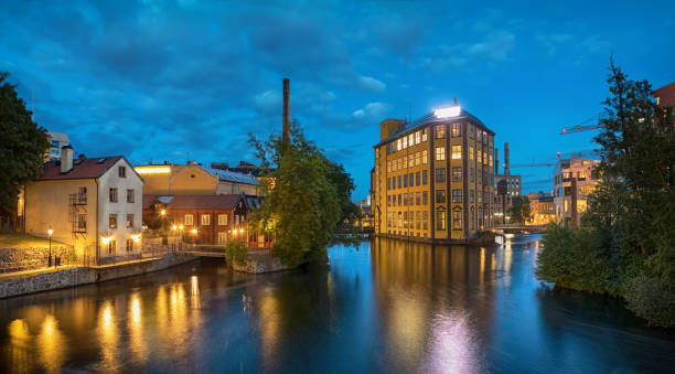 Historical textile industrial area in Norrkoping, Sweden Panorama of historical textile industrial area and Motala river in Norrkoping, Sweden ostergotland stock pictures, royalty-free photos & images