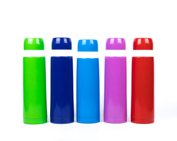 istock Green, blue, pink and red thermos bottles on white background with copy space 844928086