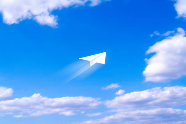 istock Blue sky and a paper airplane 844937242