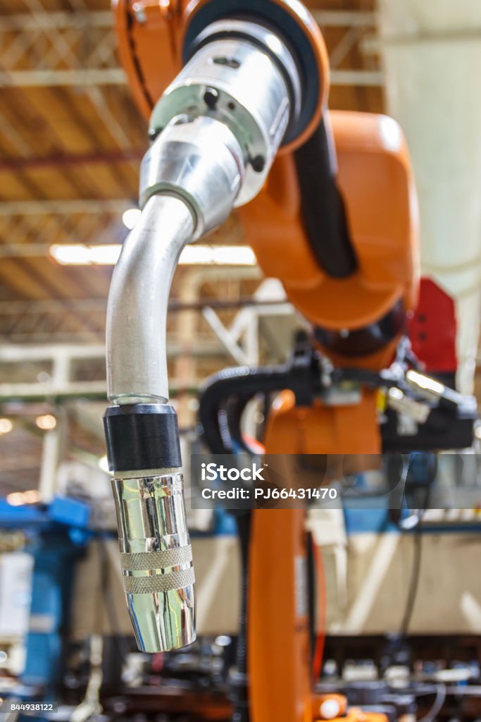 Robots welding head Robots welding in the automotive parts industry Arguing Stock Photo