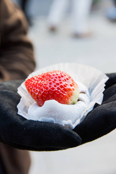 mochi filled with red bean paste mochi filled with red bean paste and topped with giant strawberry red bean dessert stock pictures, royalty-free photos & images