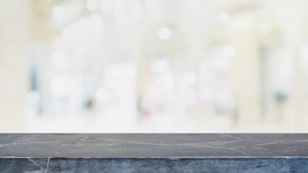 istock Black stone table top on blurred with bokeh shopping mall background - can be used for display or montage your products 844938886