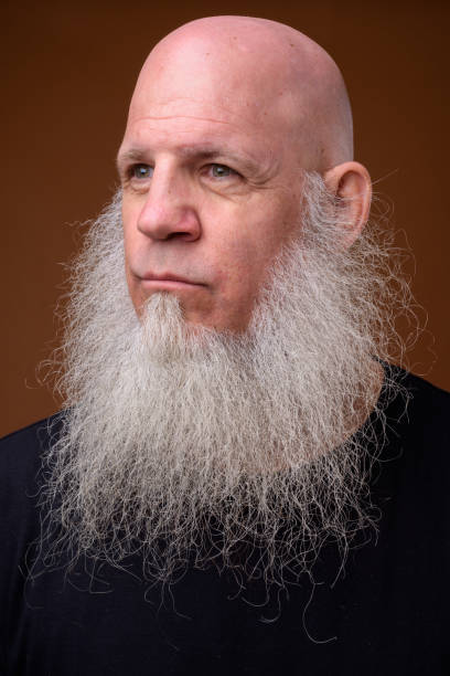 istock Portrait of bald man with long gray beard 844945322