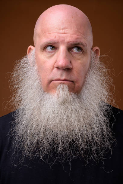 istock Portrait of bald man with long gray beard 844945366