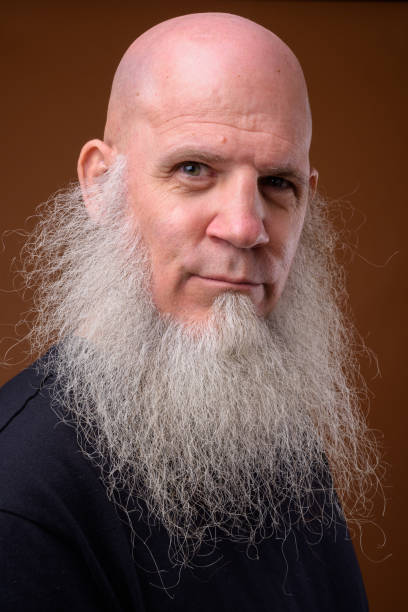 istock Portrait of bald man with long gray beard 844945444