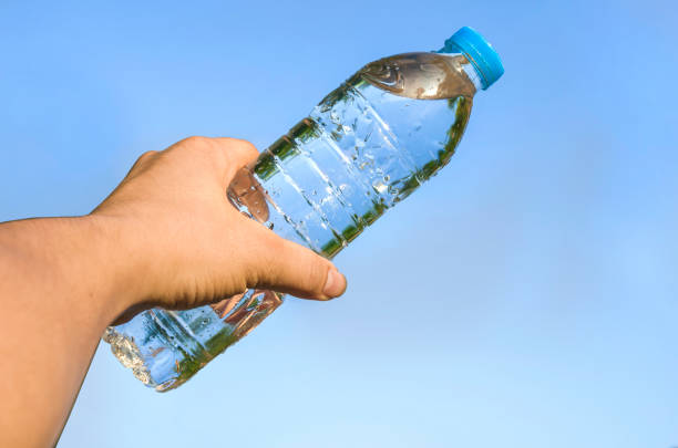 istock Hand showing the cold water bottle in to the sky. 844951476