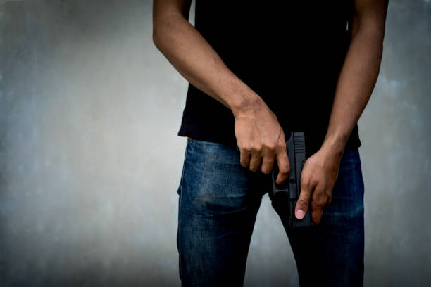 istock Man killer holding handgun for aim target shot. 844968402