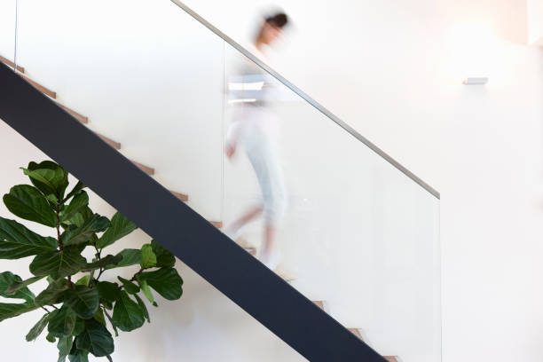 istock Woman down the stairs 844974764