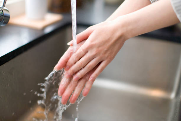 istock Women wash their hands 844977412