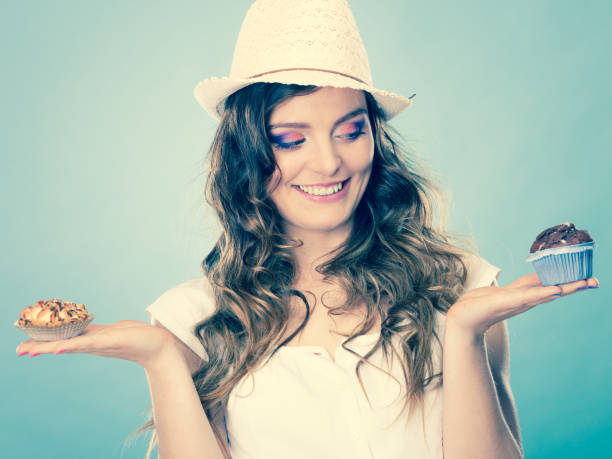 istock Smiling summer woman holds cakes in hand 845017446
