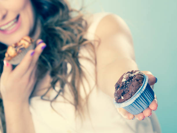 istock Smiling summer woman holds cakes in hand 845017588