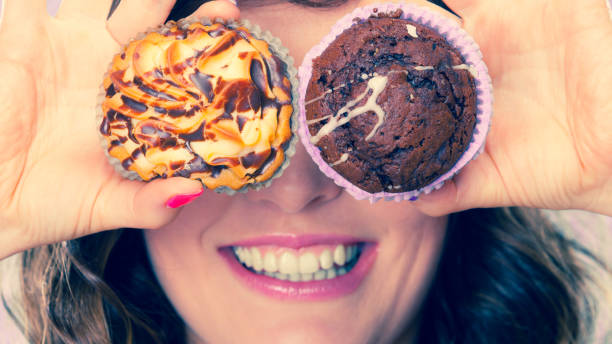 istock Smiling crazy woman holds cakes in hand 845020616
