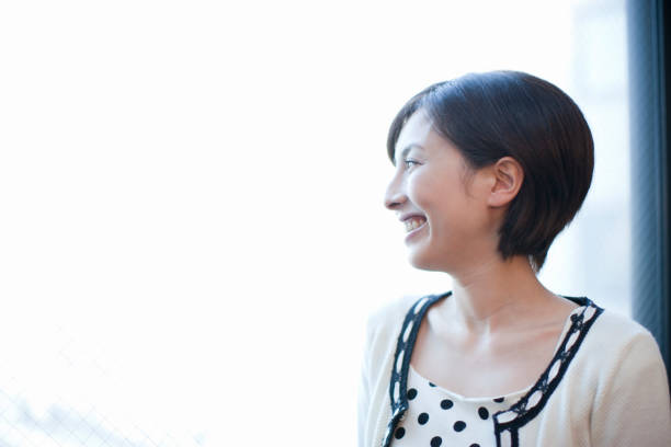 istock Women look out at the window 845031004