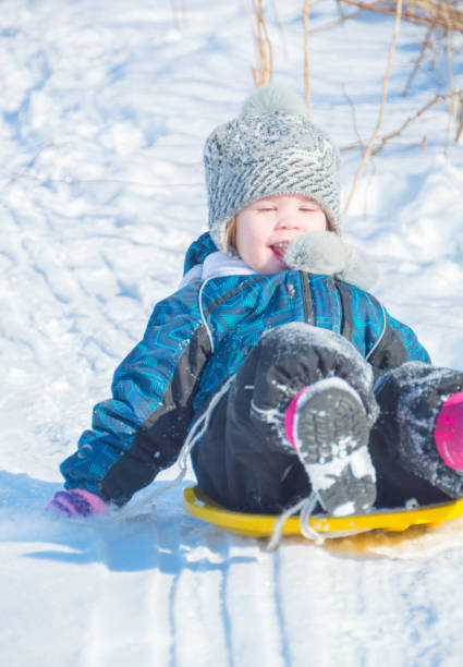 istock snow slides going child and is happy 845041342