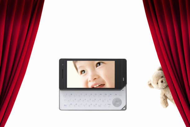 Stuffed bears and baby pictures on the mobile screen