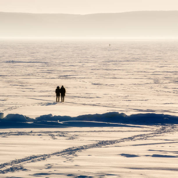 istock Features winter fishing.Cold winter evening on the river. 845053292