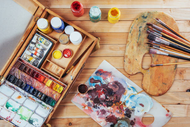 istock Box of watercolor paints, art brushes on canvas. 845058986