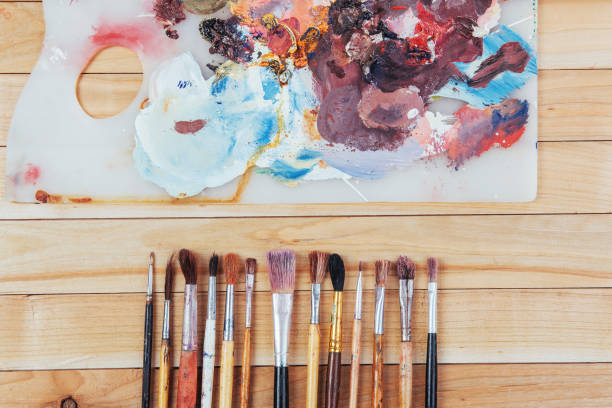istock Box of watercolor paints, art brushes on canvas. 845059206