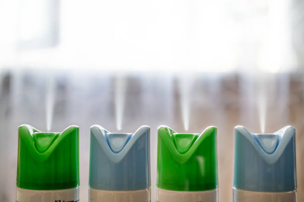 four cylinder of air freshener in a row. - air freshener imagens e fotografias de stock