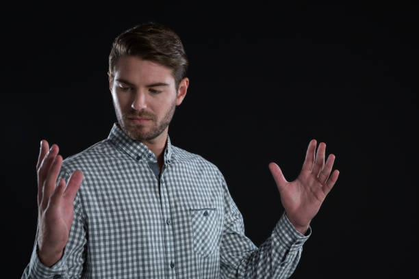 istock Man pretending to hold an invisible object 845063232