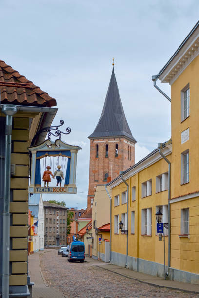 View of narrow street in old town. St. John's Church is in background.